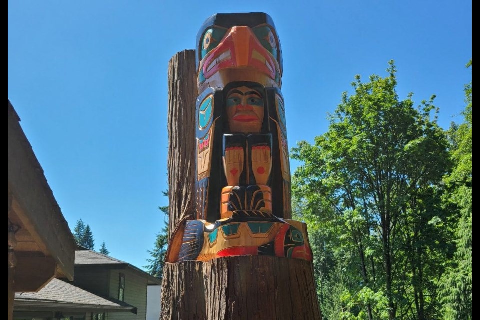 Squamish Nation artist Darren Yelton carved a totem pole into a living tree at a home in North Vancouver.