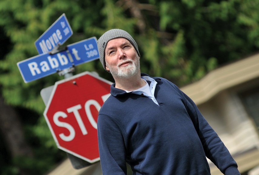 Writer, artist, unofficial generation X spokesman, and West Vancouver resident Douglas Coupland stands at the corner of Rabbit Lane and Moyne Drive in West Vancouver. Coupland is seeking help from the community for an upcoming art project inspired by his 1998 novel 'Girlfriend in a Coma.'