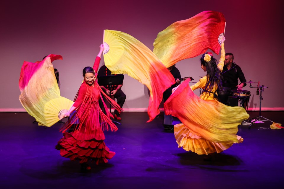 Kasandra Lea and Cyrena Huang dance flamenco with Chinese silk fantails.