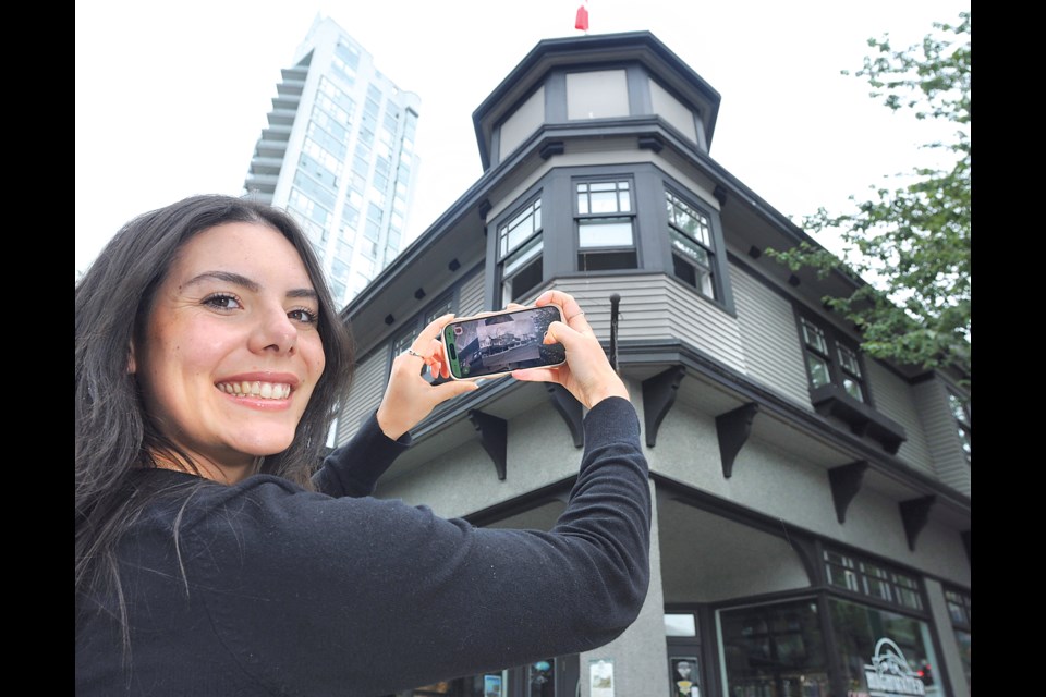 Rebecca Lyon of North Shore Culture Quest tests out a new North Van Arts app that guides users on an interactive tour of historical and public art sites across the North Shore. | Paul McGrath / North Shore News