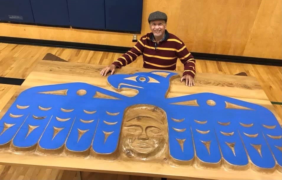 Latash Maurice Nahanee shows his finished carving of a Thunderbird for Carisbrooke Elementary. 