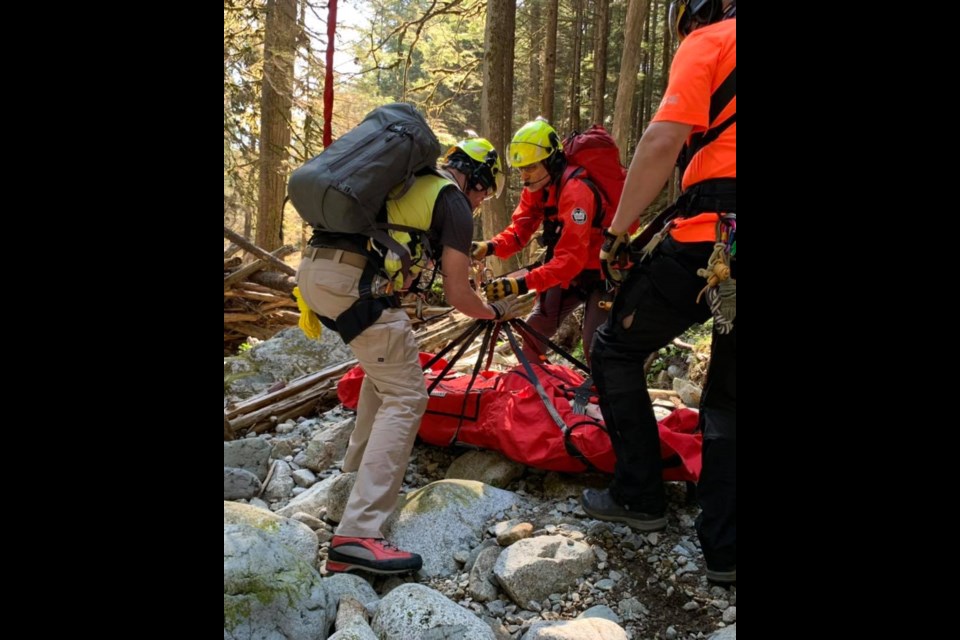 A team from North Shore Rescue readies an injured hiker for transport from Mount Seymour.