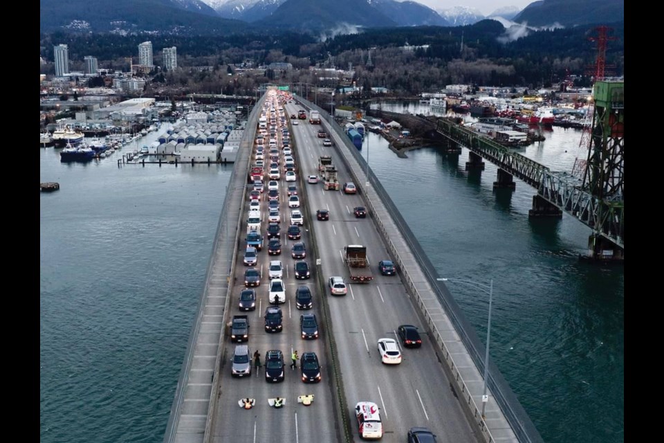 Old-growth activists block the Ironworkers Memorial Second Narrows Crossing during rush hour Monday, Jan 31, 2022.