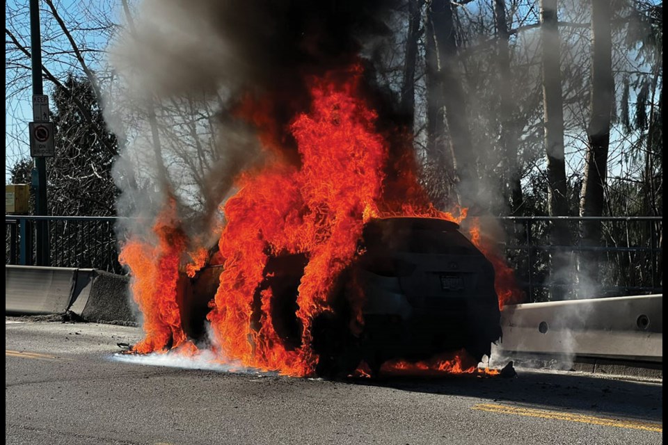 A Hyundai Tucson burns on Lions Gate Bridge Saturday afternoon (Feb. 12).