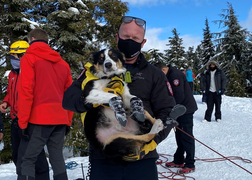 North Vancouver fire Capt. Paul Cylla is all smiles under his mask after assisting in the rescue of a stranded dog and his human. 