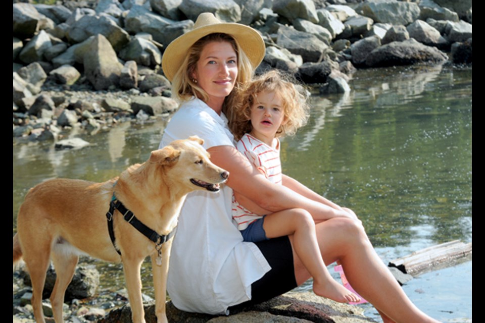 West Van resident Emilyn Golden with daughter Ava and dog Indy reflects on her rescue of a teen from the waters off Dundarave Beach on Friday.