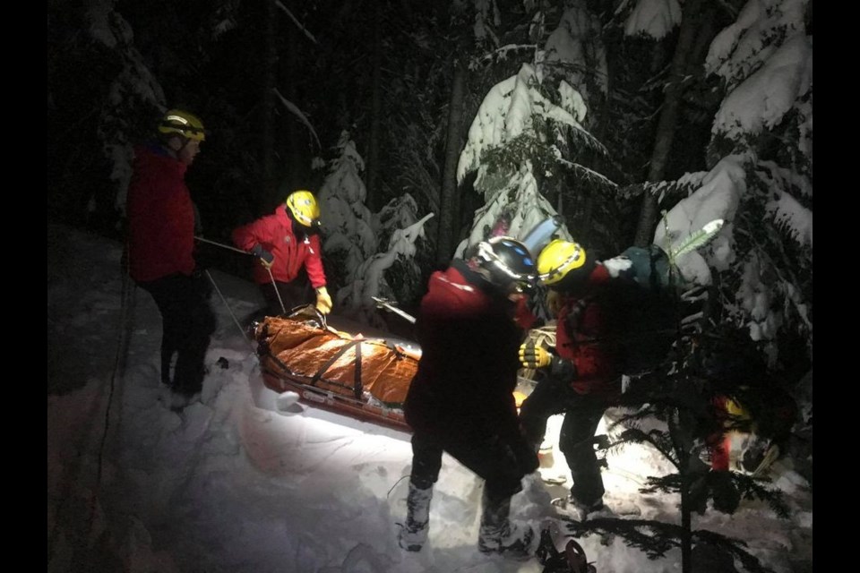 North Shore Rescue crews rescued a snowboarder who had been partially buried in an avalanche Tuesday night.