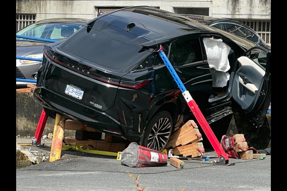 A black Lexus damaged after an incident in a London Drugs parking lot Wednesday afternoon. | Pat Bell 