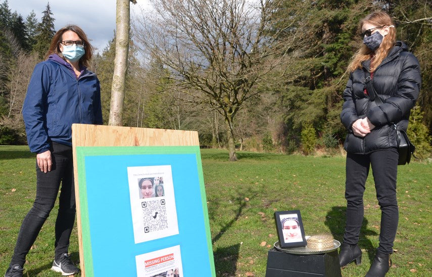 Missing person advocates Sheila McFarland and Anne Gavin prepare to hand out flyers in North Vancouver's Heywood Park Wednesday (March 10) to help in the search for Fatemeh Abdolali, missing since Feb. 26.