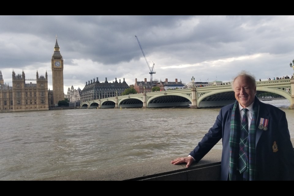 West Vancouver's Roddy MacKenzie takes a break in front of the British Parliament during a nine-hour wait to pay respects to the Queen this week