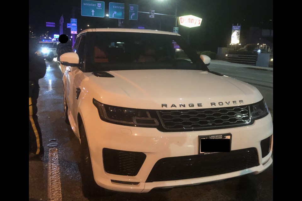 North Vancouver RCMP stopped this Range Rover at a road check early Tuesday morning (May 18, 2021) and seized drugs, cash and a knife from a man police say is a "known gang associate."