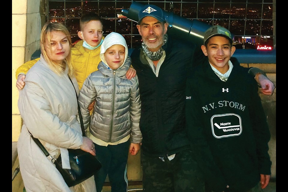 North Vancouver resident Steve Wright and his son Indiana (right) meet Ukrainians Svitlana and her sons Demian and Myroslav, in Poland. Wright will be hosting the refugees in North Vancouver.