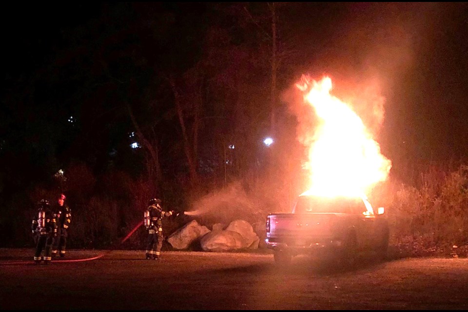 North Vancouver crews work on the scene of a truck arson in Central Lonsdale, March 28, 2022.