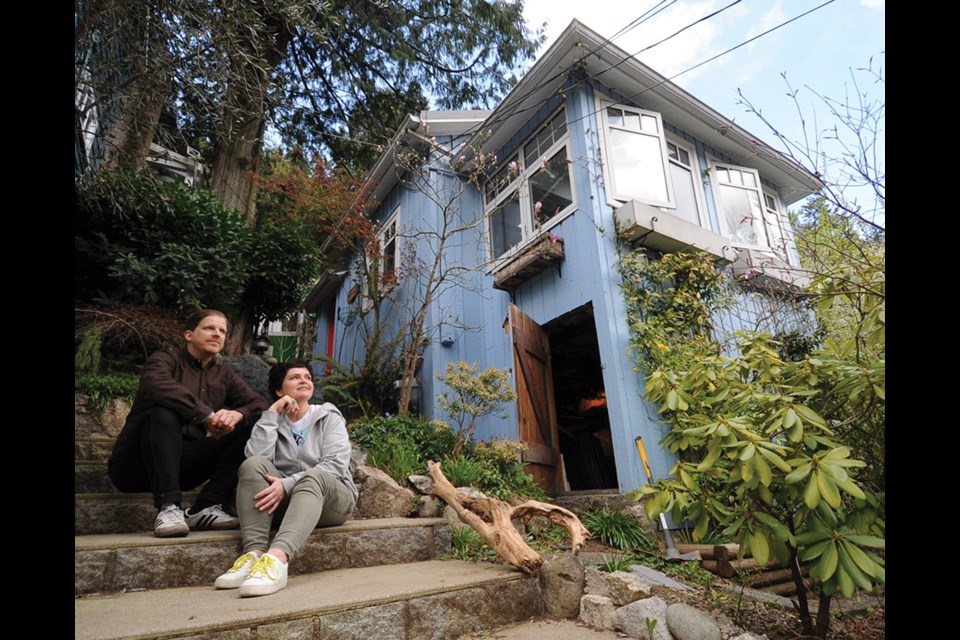 Matt Fidler and Heidi Woodley at the property in Horseshoe Bay, where eight owners will have a share of the cottages on Nelson Avenue under a co-housing arrangement.
 