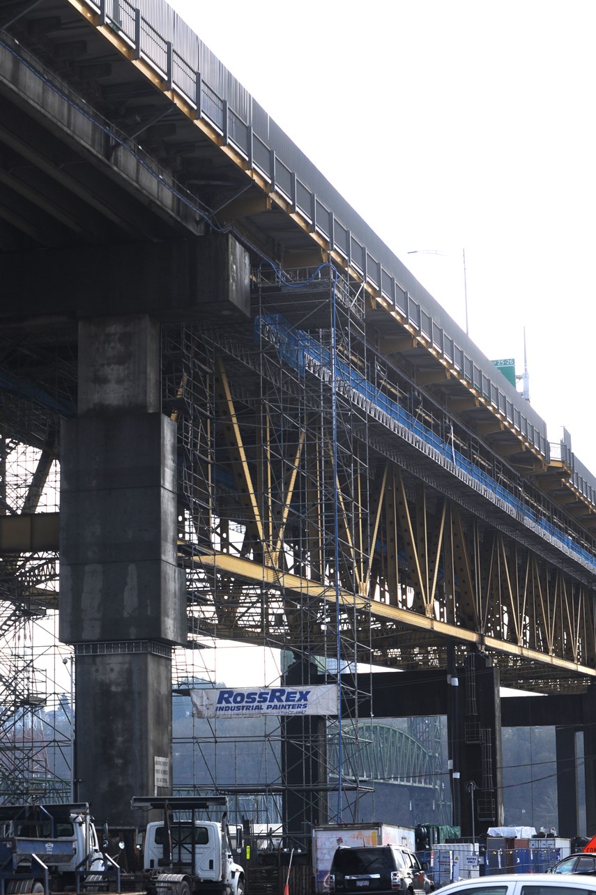 Ironworkers painting web