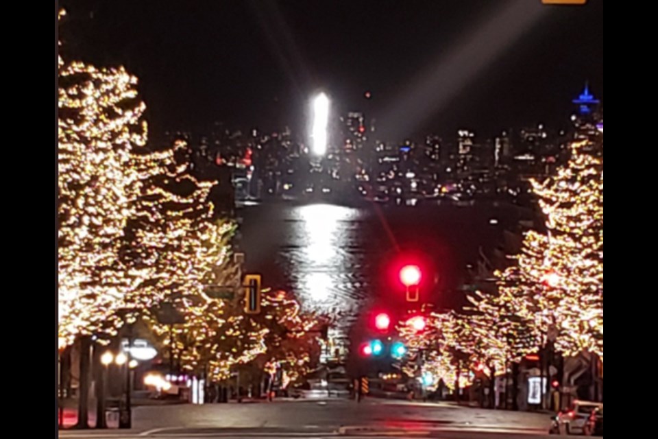 A beam of light stands out on Burrard Inlet, on Monday, Nov. 1, 2021.