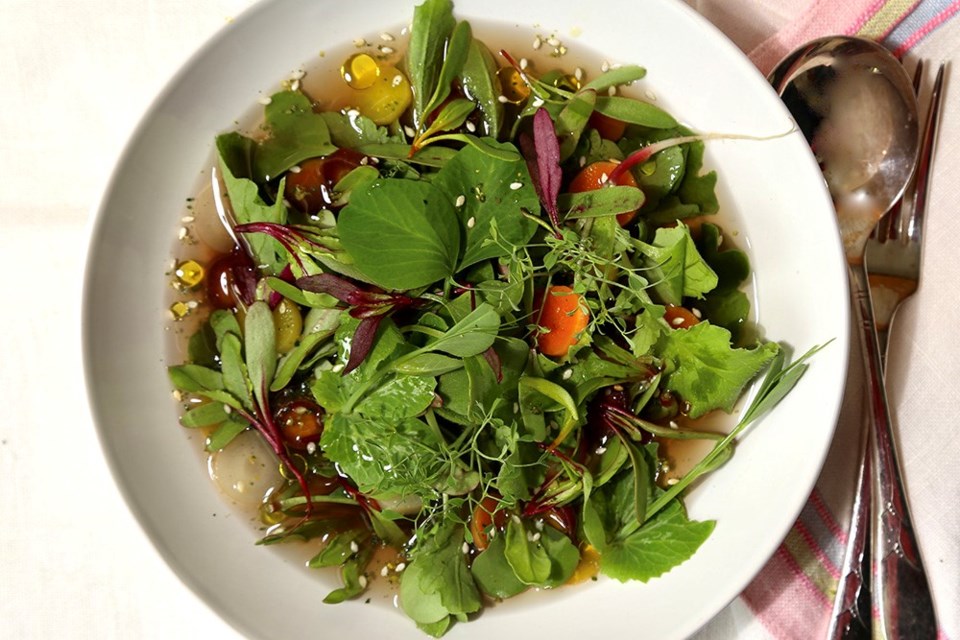 Wilting just-snipped thinning greens top hot dashi and shiitake broth.