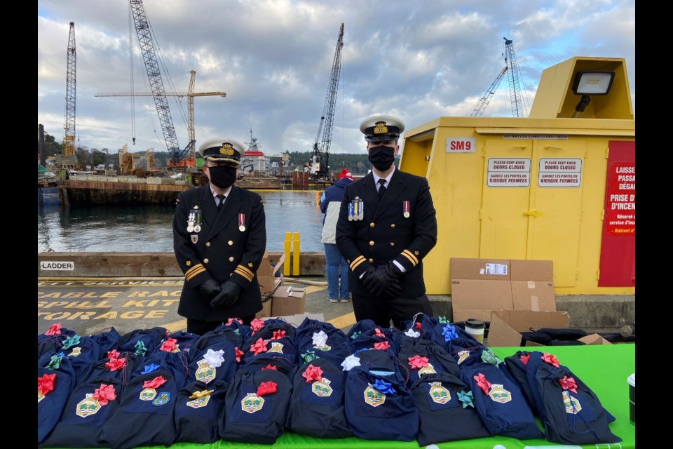 Lt.-Cmdr. Cliff Mah and Lt. Ryan Moore were able to hand out Ditty Bags to the returning sailors of HMCS Winnipeg in December 2021.