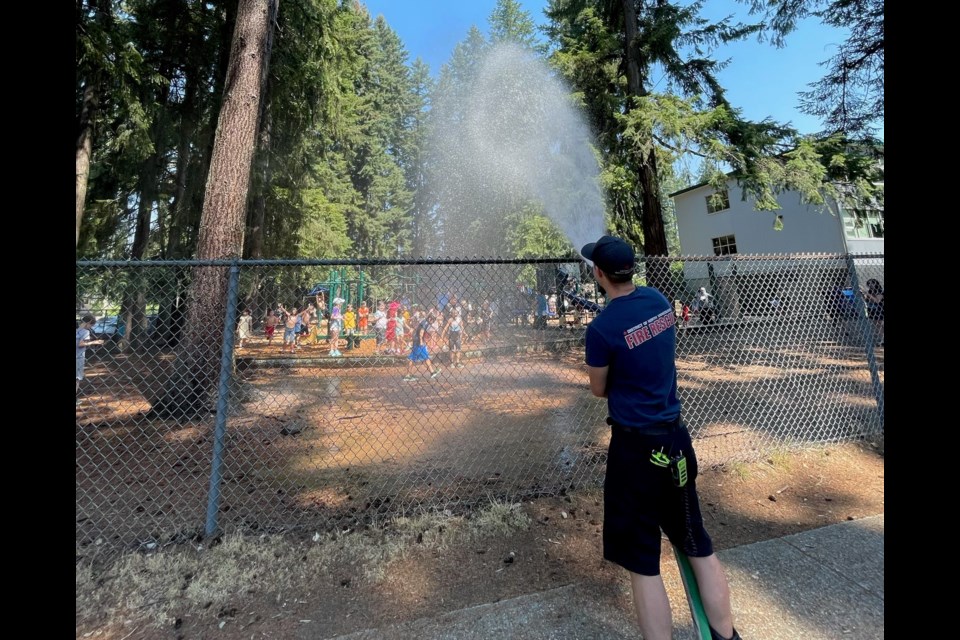 Giggles and squeals were heard at four elementary schools in North Vancouver today as students enjoyed a much-welcomed soaking by fire hoses as they ran out of class to kick off their summer break.