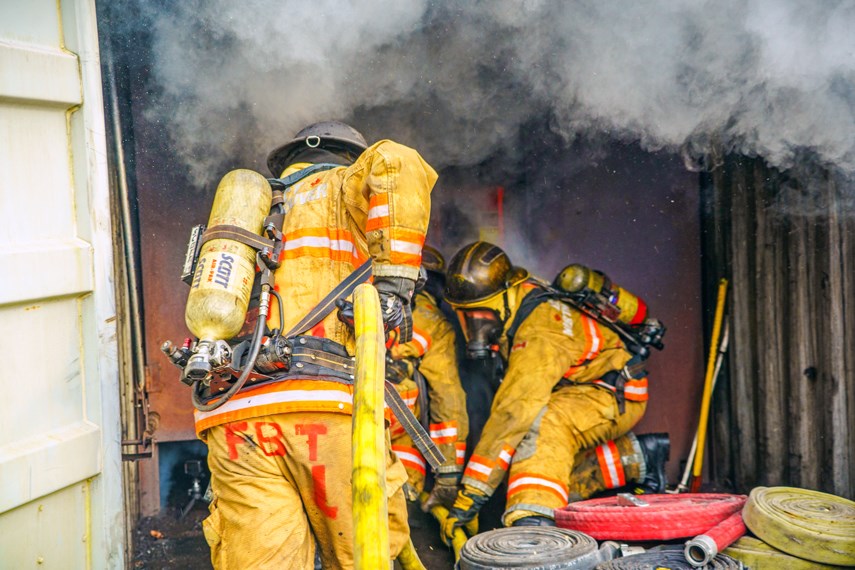 Probationary firefighters with District of North Vancouver Fire and Rescues Services participate in a training exercise at the department's Fire Training Centre last month.