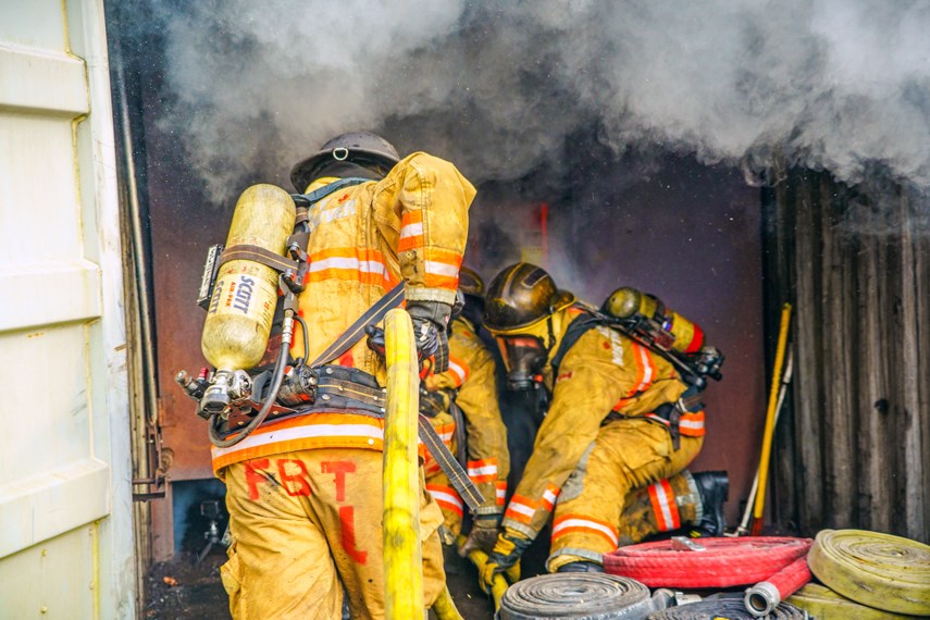 Probationary firefighters with District of North Vancouver Fire and Rescues Services participate in a training exercise at the department's Fire Training Centre last month.
