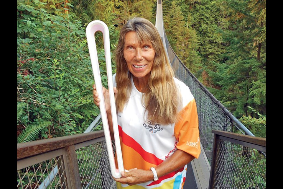 Elaine Tanner, pictured here on the Capilano Suspension Bridge in 2017 during the Queen’s Baton Relay, has a message for athletes whose Olympic dreams were dashed last year and are struggling to compete in the rescheduled games: “You are far more than a swimmer, or a track star, or an athlete.”