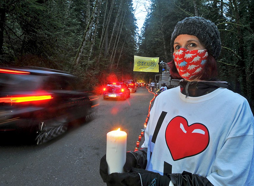 Lynn Valley resident Jen Barsky was one of the many volunteers helping out at the Lynn Valley Drive Thru Candlelight Vigil at Lynn Canyon Park in tribute to the recent stabbing attack at Lynn Valley Village. Hundreds of vehicles lined up to support and pay respects.