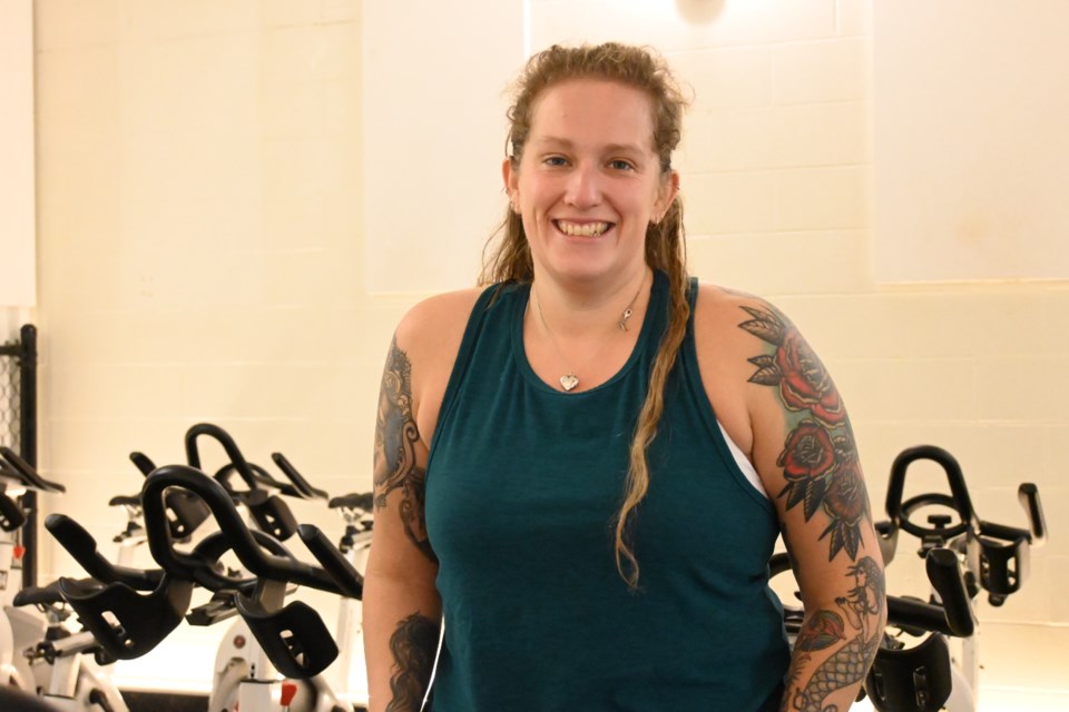 North Vancouver resident Heather MacDonald sitting on a spin bike at Spin Society in Lynn Valley after she set the Guinness World Record for the most spin classes completed in a year. | Abby Luciano / North Shore News 