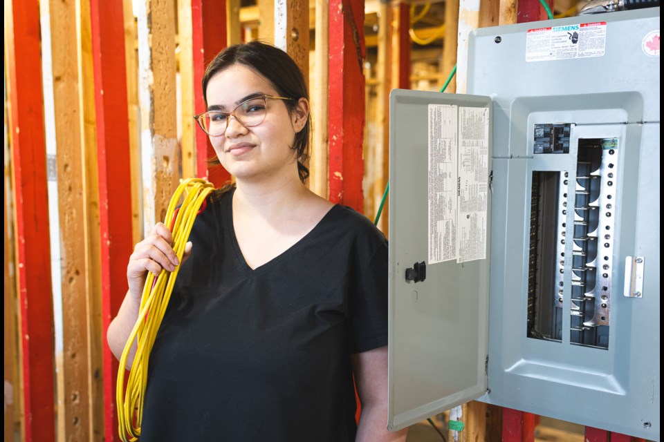 British Columbia Institute of Technology electrical student Paige Charles stands near an electrical box in one of her classes. | Sebastian Aranciba