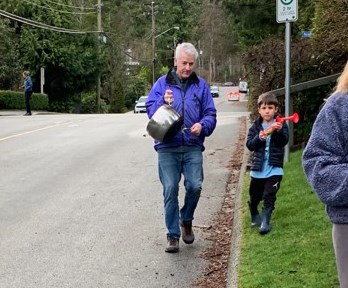 Paul Weir and his grandson Cooper lead the cheer on Coleman Street in North Vancouver. The street has cheered for pandemic frontline workers every single night at 7 p.m. since March 28, 2020.