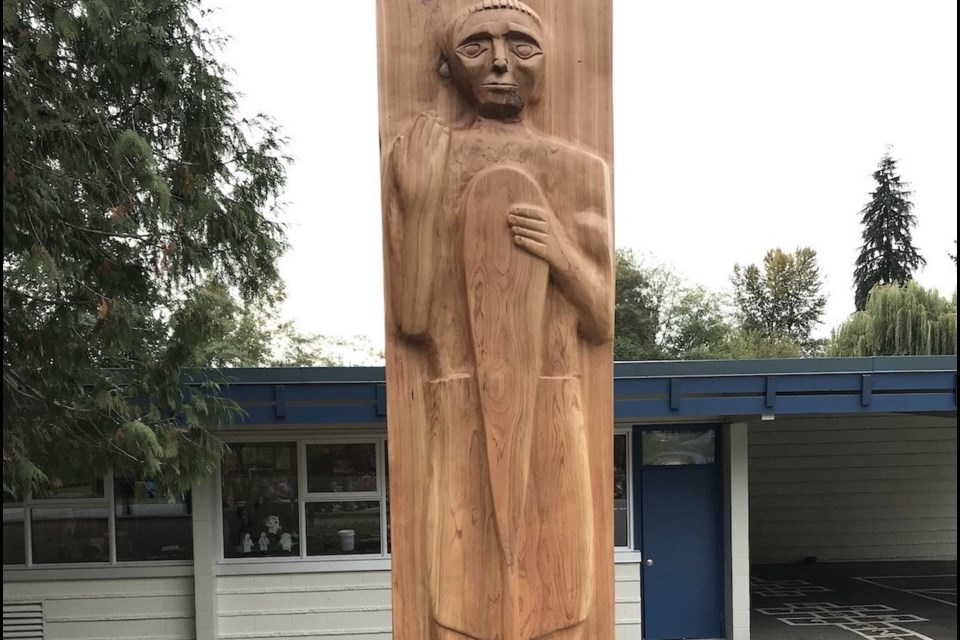 The Welcome Figure of a Skipper was carved by Latash, Maurice Nahanee, a Squamish Nation Elder, traditional artist, and mentor, with the support of his assistant, Chris Fyfe at L'École Cleveland Elementary in the fall of 2018 – along with a little help from eager students.