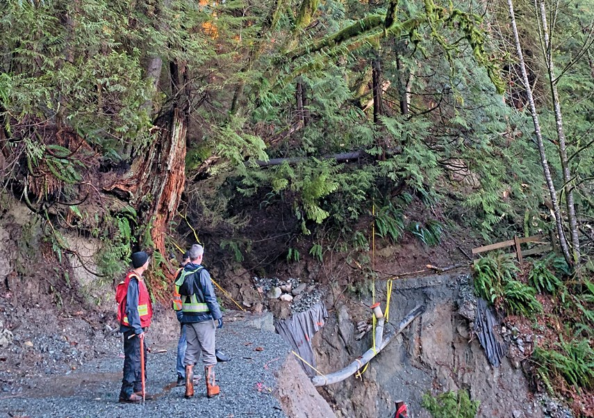 Crews inspect the slide area at West Vancouver's Capilano Pacific trail, January 2021.
