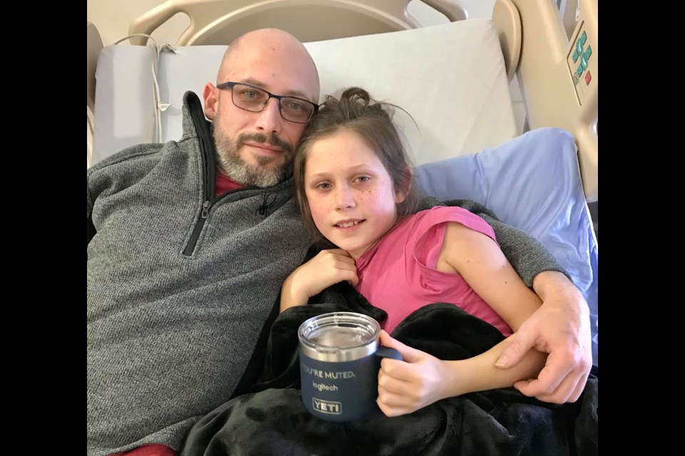 Jillian Rondeau with her dad Jean-Marc Rondeau in hospital. The 10-year-old spent over a week in hospital fighting a post-COVID-19 inflammatory syndrome.