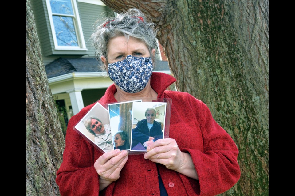 Kathie Boyd holds photos of her mom Donna prior to COVID and today. Boyd has spent months fighting for more meaningful visits with her mom, who lives in Lynn Valley Care Centre.