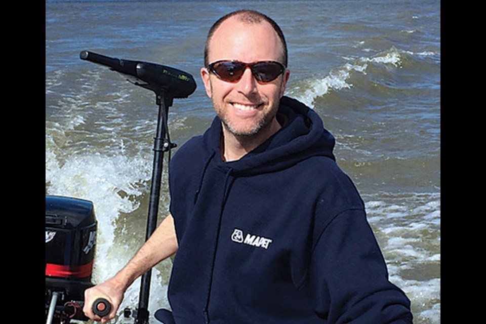 Reid Hance, 46, a graduate of North Vancouver's Handsworth Secondary, died suddenly at home in Delta April 14 after contracting COVID-19. Hance, pictured here on the Fraser River, liked to take his boys to local lakes when he could.