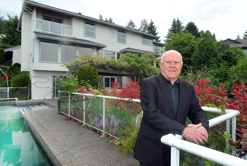 Real estate agent Calvin Lindberg of Angell Hasman and Associates, attends one of his listings in West Vancouver on Monday, May 17, 2021. The local real estate market is hot again this year.