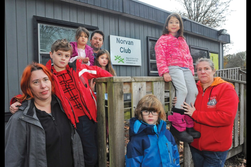 Parents Diana Krebs (left), Mike Kim and Canan Janan Duru and their children are not happy that the BGC after-school care at Lynnmour Elementary has been closed since last June over a staffing shortage.