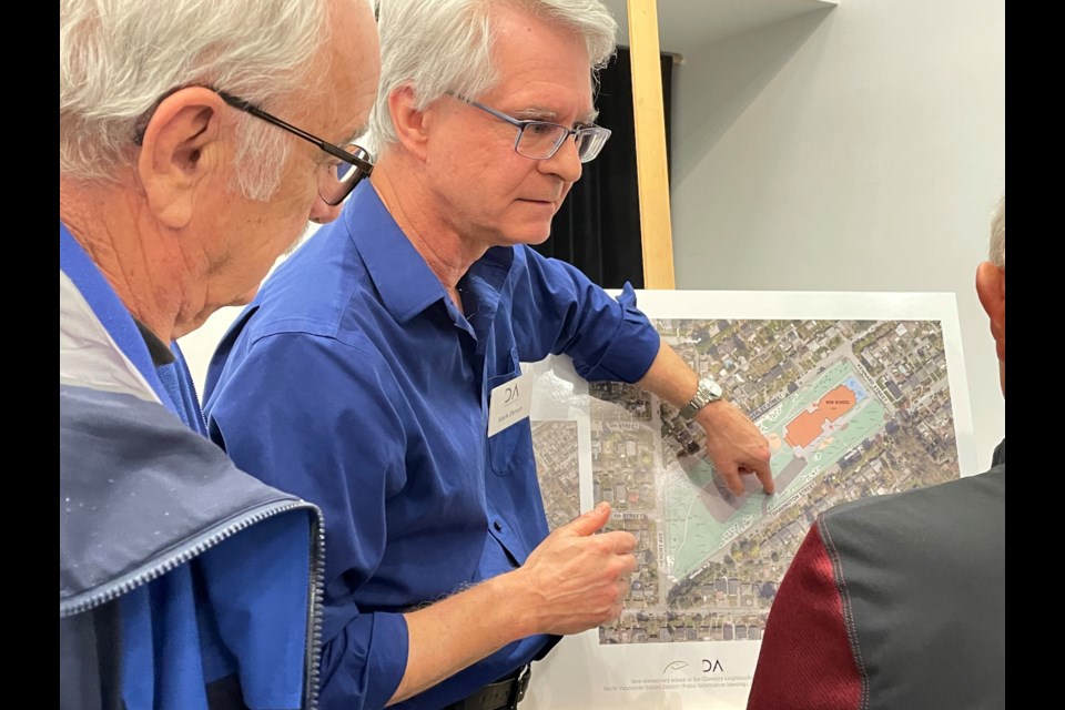 Consultant Mark Ehman of DA Architects & Planners goes over plans with area residents Wednesday night at a school district information meeting.