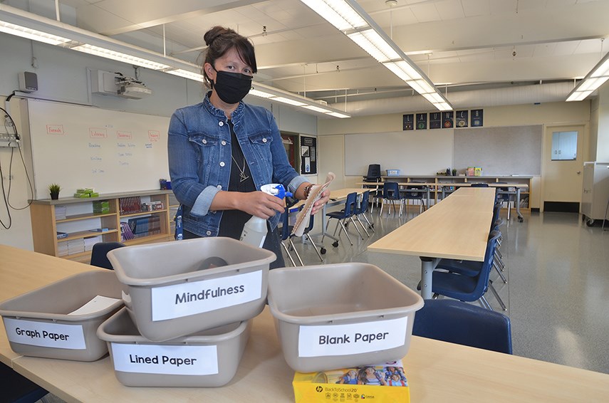 Vice-principal Robyn Evans prepares her Grade 7 classroom for upcoming new school year at West Vancouver's Gleneagles Elementary.