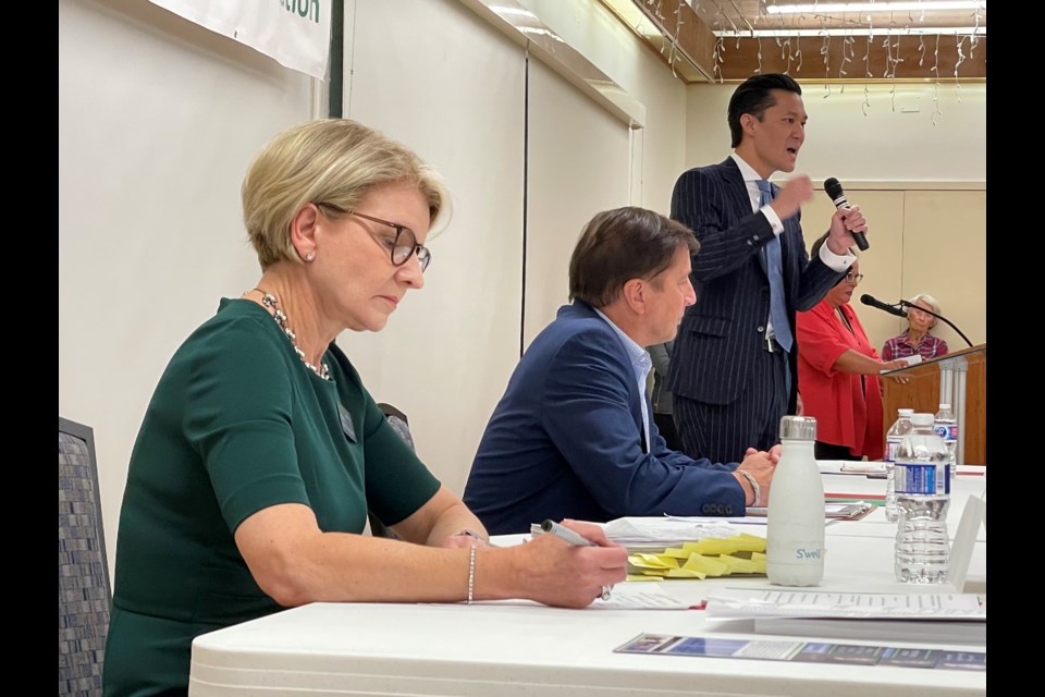 Marcus Wong makes a point before a standing room only crowd who turned out to the seniors activity centre in West Vancouver to watch three of the four candidates for mayor debate.