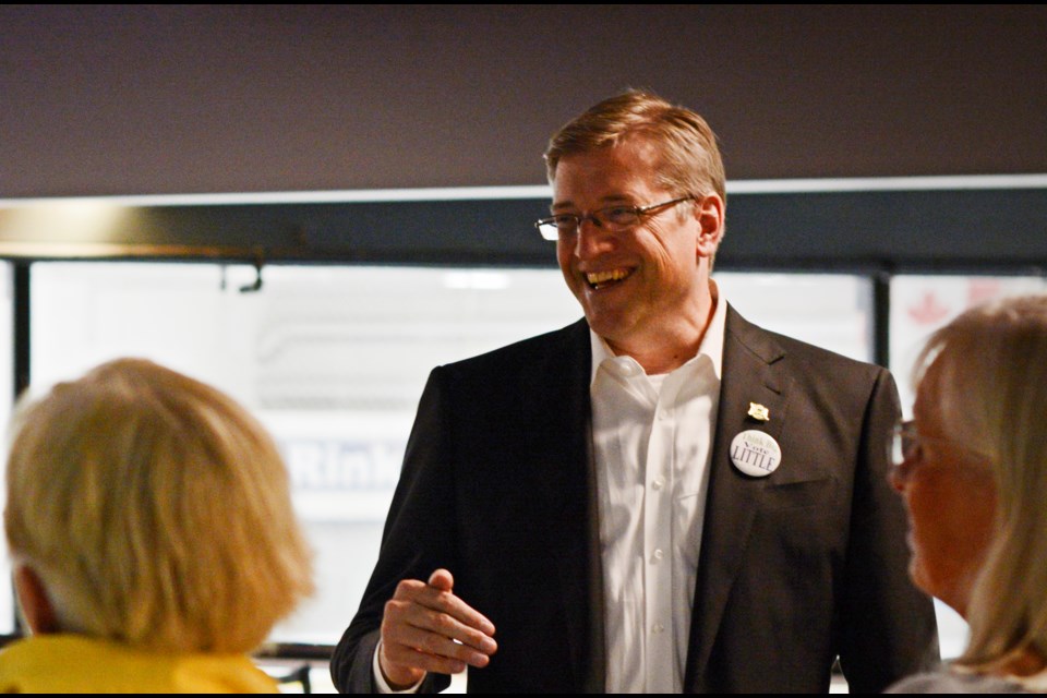 Mayor-elect Mike Little celebrating his win at Canlan Ice Sports.