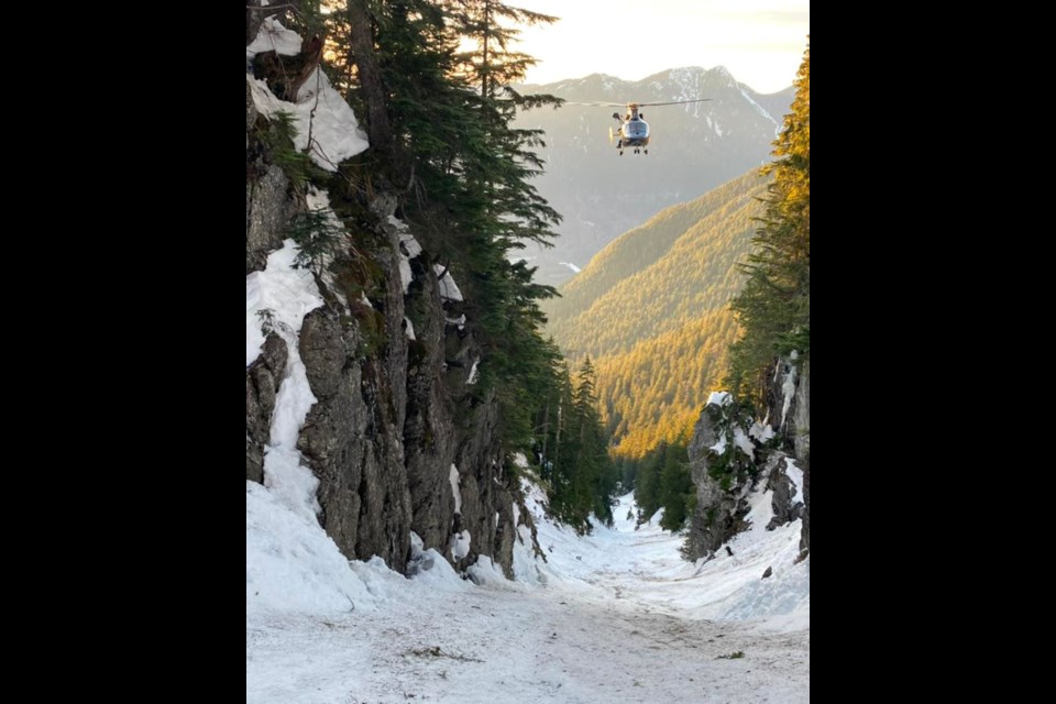 North Shore Rescue members carry out a helicopter extraction from the North Vancouver backcountry, Jan. 26, 2021.