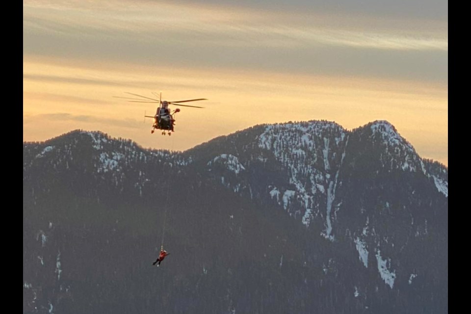 North Shore Rescue members carry out a helicopter extraction from the North Vancouver backcountry, Jan. 26, 2021.
