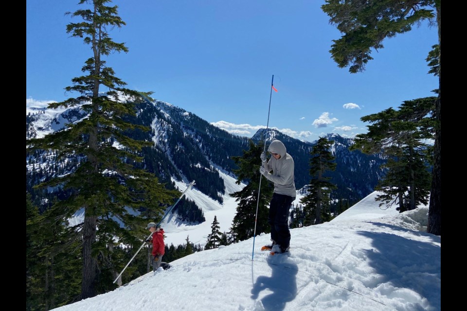 Metro Vancouver watershed staff conduct a snowpack survey on the west side of Loch Lomond, an alpine lake in the Seymour watershed. 
