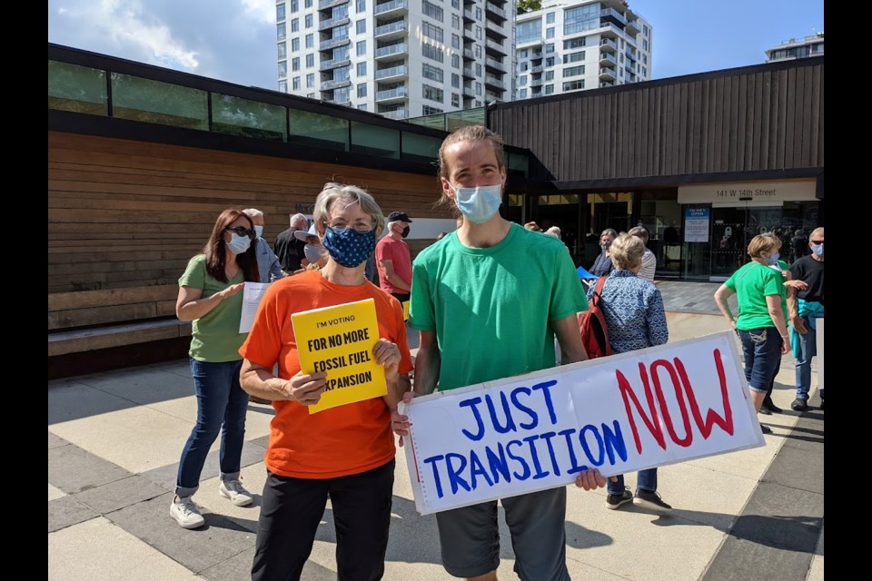 Organizer Robyn Newton and Adam Wray were among those rallying for action on climate change in North Vancouver Wednesday, Sept. 8, 2021.