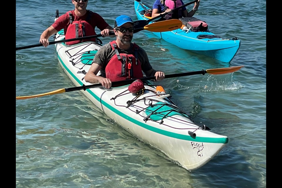 Minister of Environment and Climate Change Steven Guilbeault kayaks in Howe Sound Thursday after announcing funding of $926,000 for environmental projects in the region.