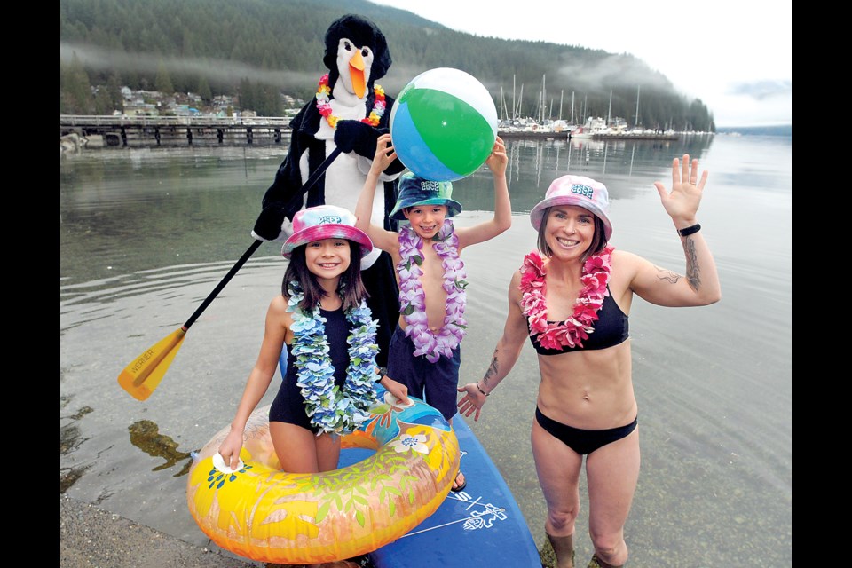 Karly and Mike Darbyshire (a.k.a. the Penguin) are joined by their children Kanami and Kane to invite the public to ring in the New Year at the annual Penguin Plunge in Deep Cove Jan. 1.  