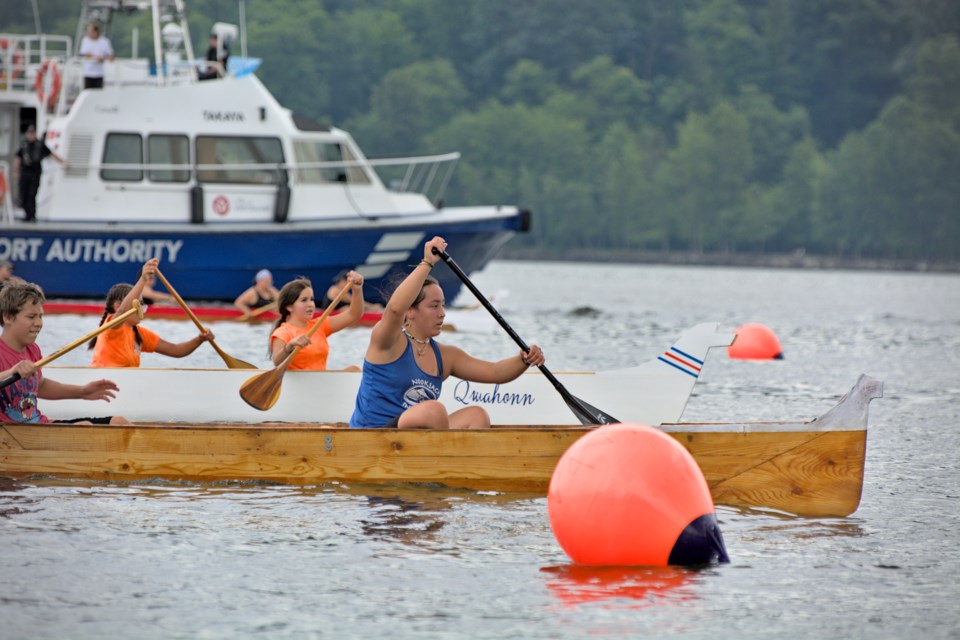 Teams in the 16-and-under group cross the finish line at the Whey-ah-Wichen Canoe Festival on Saturday. First Nations from Coast Salish territory across the Lower Mainland, Vancouver Island and Washington State gathered to compete.