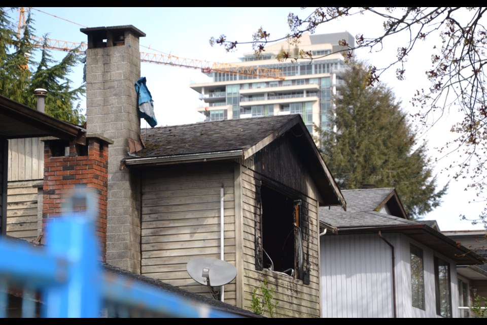 A vacant home on the 400 block of Marie Place in North Vancouver sits damaged after a fire on Tuesday, April 12, 2022.