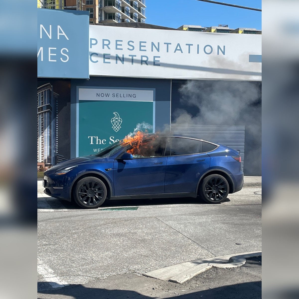 North Vancouver Tesla driver kicks out window to escape fire